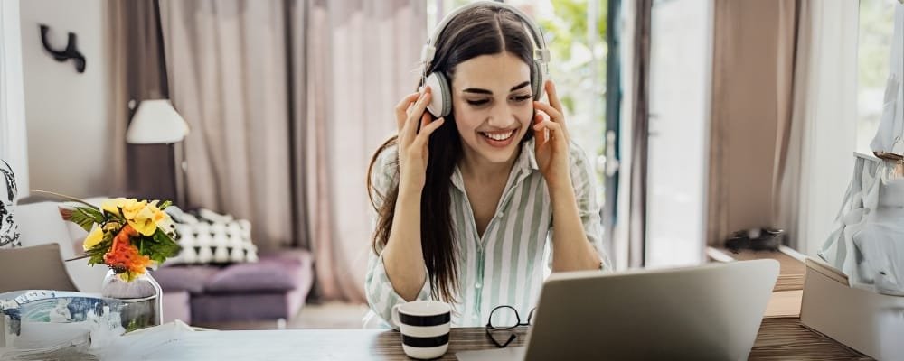 Student practicing IELTS listening tips with headphones